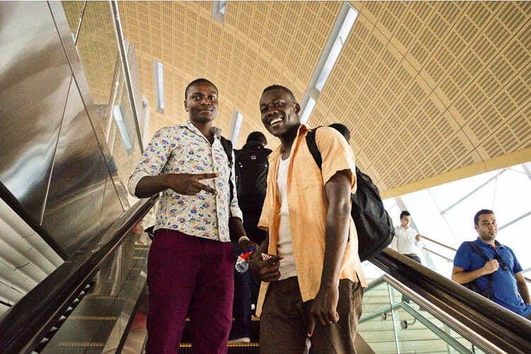 ReadTrips students on an escalator in a Dubai metro station