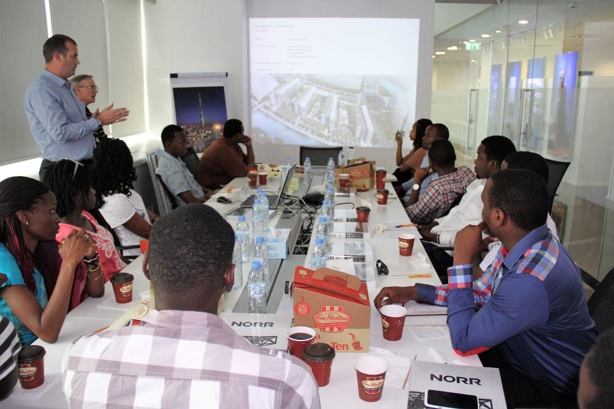 Students in a briefing at an architecture and design firm