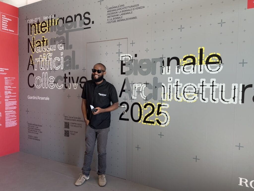 A ReadTrips traveller in front of the Biennale Architettura 2025 signage in Venice